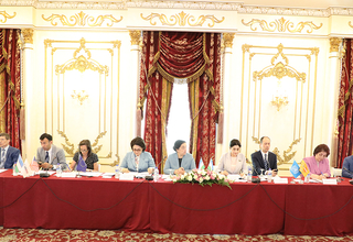 group of people -participants of the meeting sit at the table