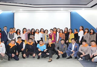 group of people -participants of the meeting sit at the table