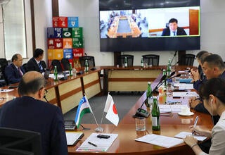 group of people -participants of the meeting sit at the table