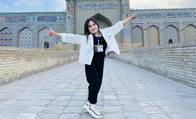 Mendayim is standing near Kokand Khan Palace