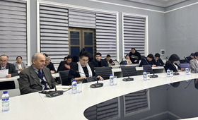 group of people -participants of the meeting sit at the table