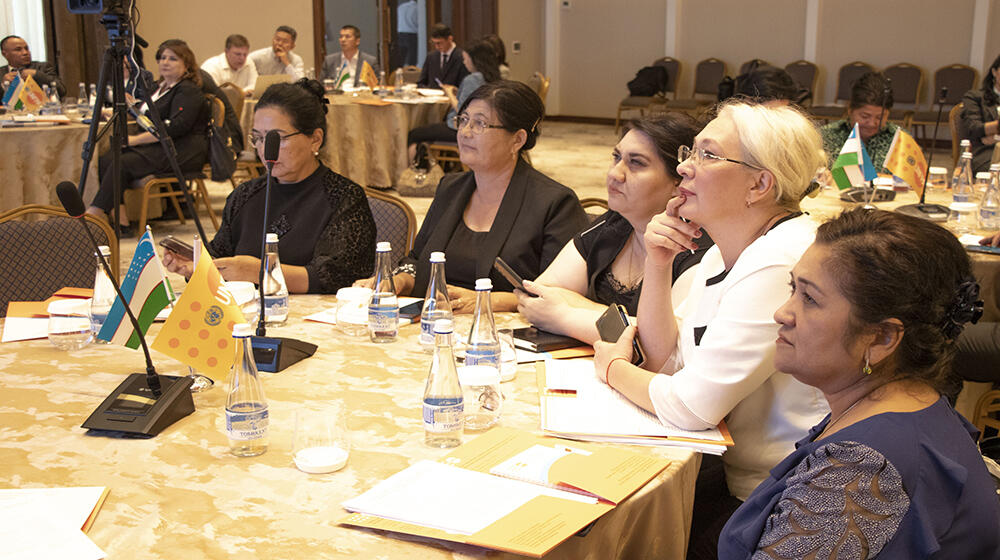 group of people -participants of the meeting sit at the table