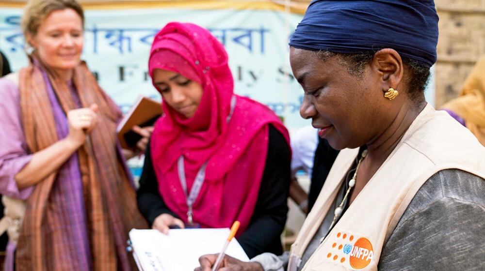 Natalya Kanem writing notes