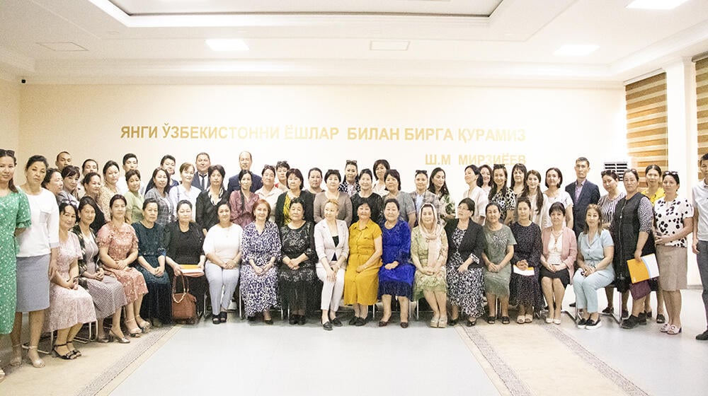 group of people -participants of the meeting are standing