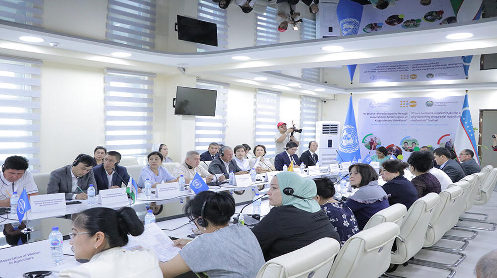 group of people -participants of the meeting sit at the table