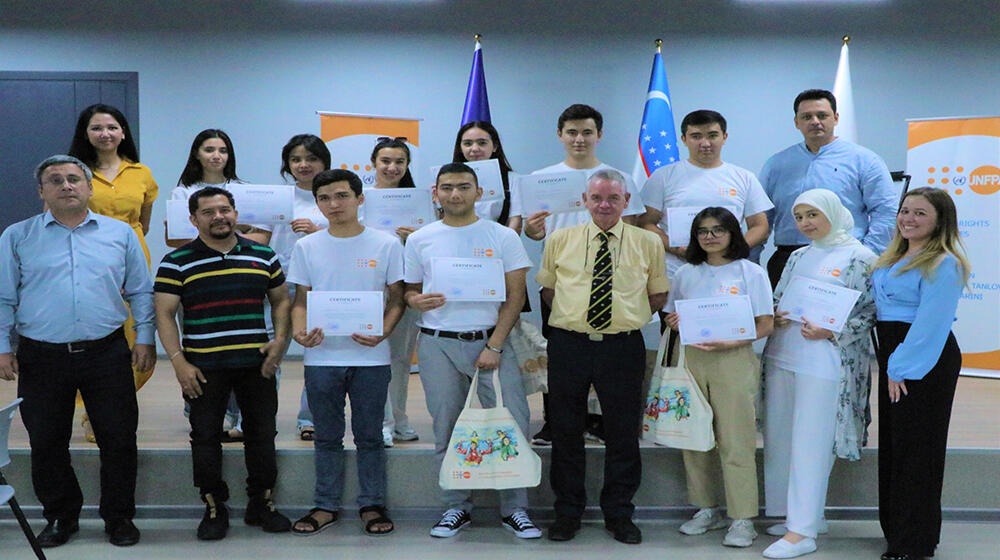 group of people -participants of the meeting are standing