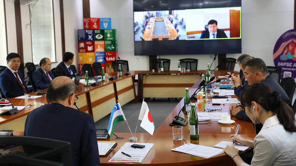 group of people -participants of the meeting sit at the table