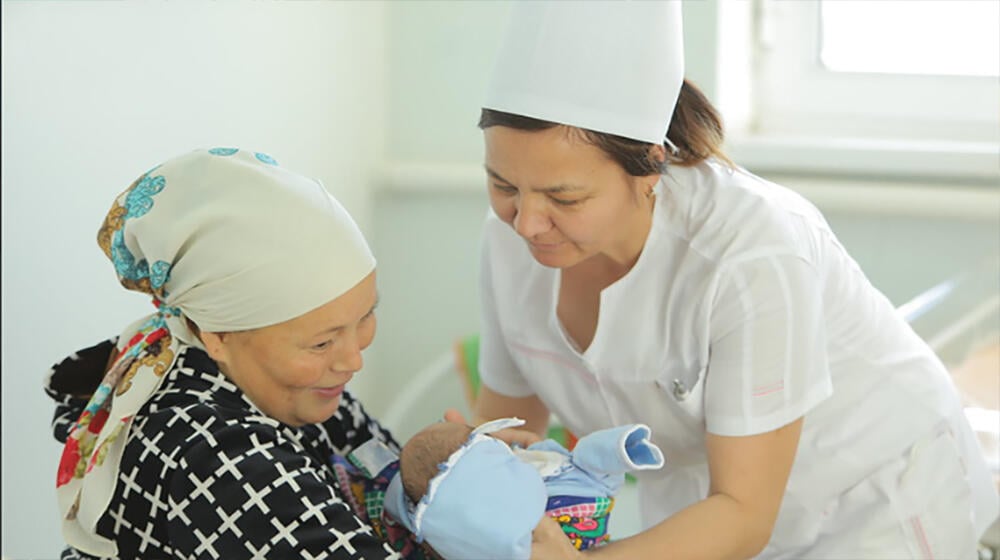 Mother and baby with midwife