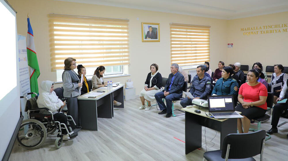 group of people -participants of the meeting sit at the table