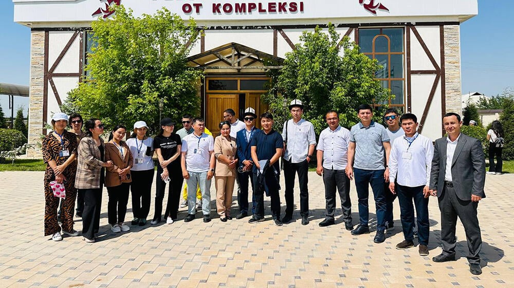 group of people -participants of the meeting are standing