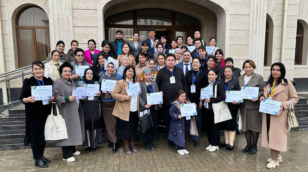 group of people -participants of the meeting are standing