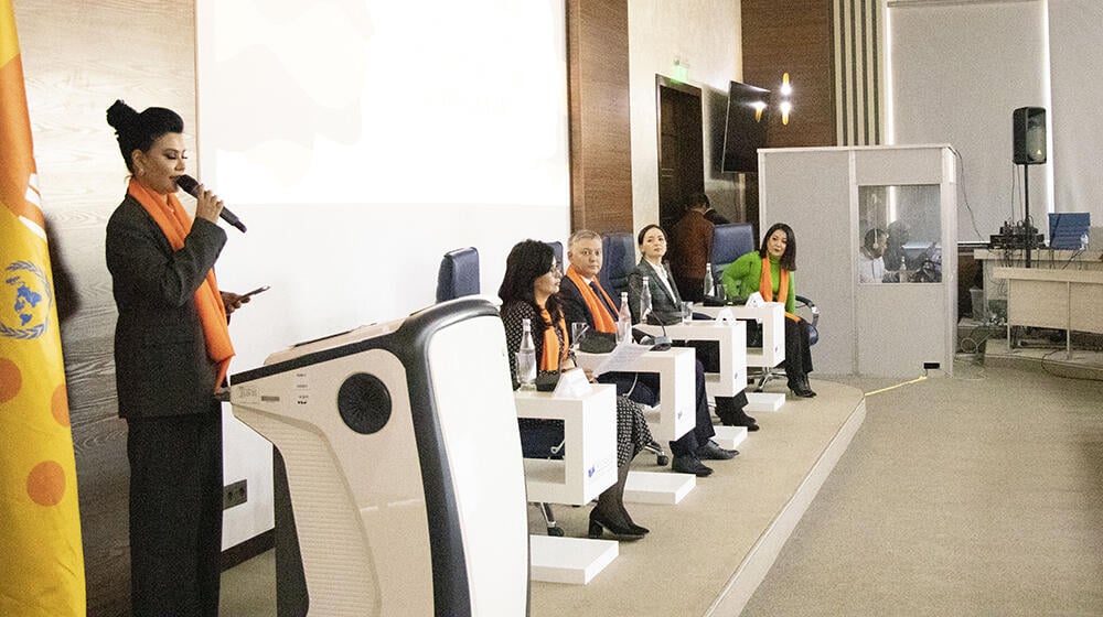 panelists of the conference are sitting on chairs