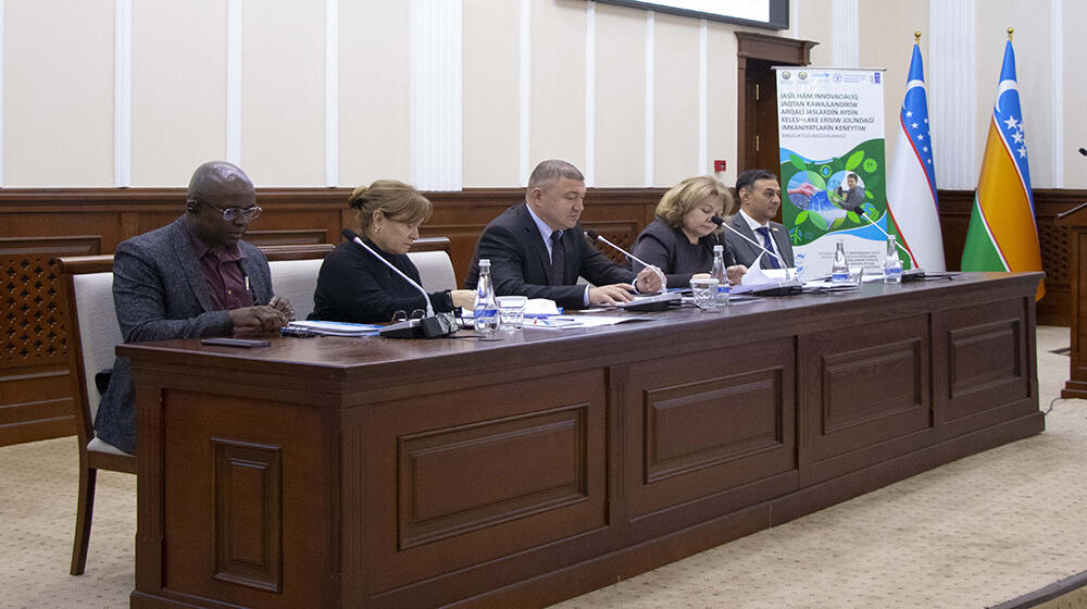 group of people -participants of the meeting sit at the table